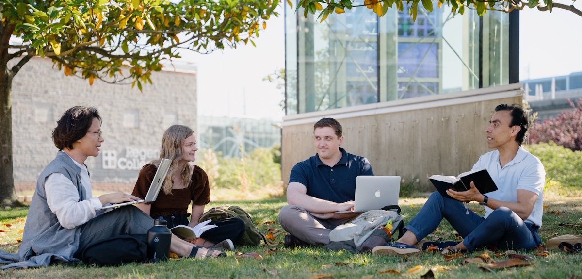 students sitting in lawn